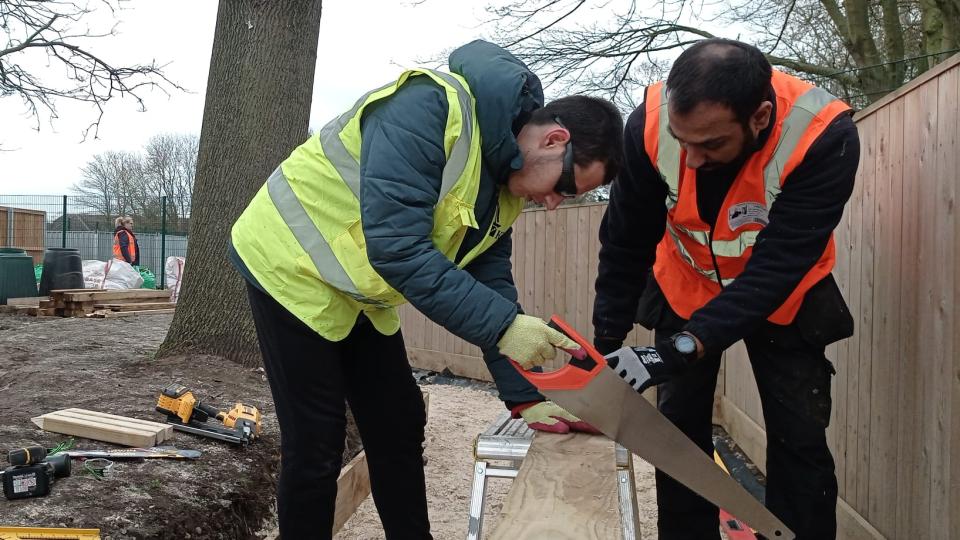 Volunteers working in a garden